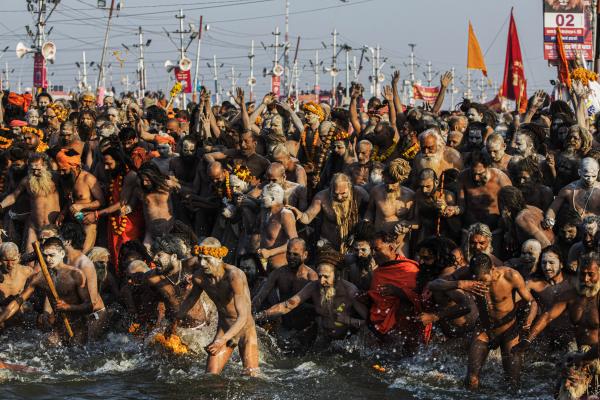 Image from Religion and Festivals - Indian naked sadhus (Hindu holy men) bathe at the Sangam...
