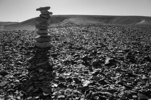 Zen stones pyramid in desert | Buy this image