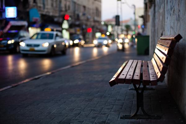 Evening traffic, empty bench | Buy this image