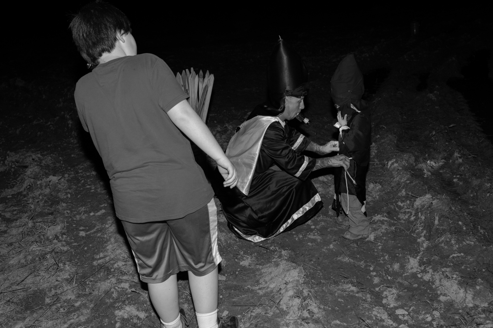 Ku Klux Klan -  Trion, Georgia. With a flashlight in his mouth,...