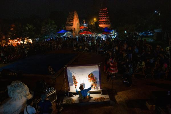 Image from Singles -  Shadow puppet performer performs in front of hundreds of...