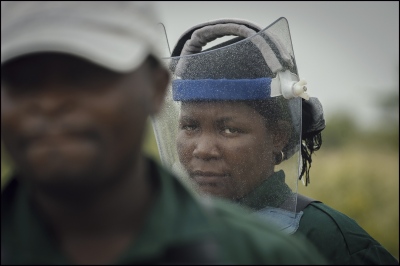 Image from Women De-Miners, Mozambique. -  Demining stops due to the rain limiting visibility in...