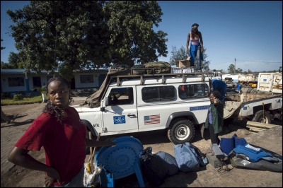  Deployment day at the HALO head quarters compound in Zimpeto, Maputo, Mozambique. L-R Women section De Miners Amelia Zulmira (21), Helena Wetela (28) and Luisa Chelene (29) load up their landrover before travelling to Damo camp. 