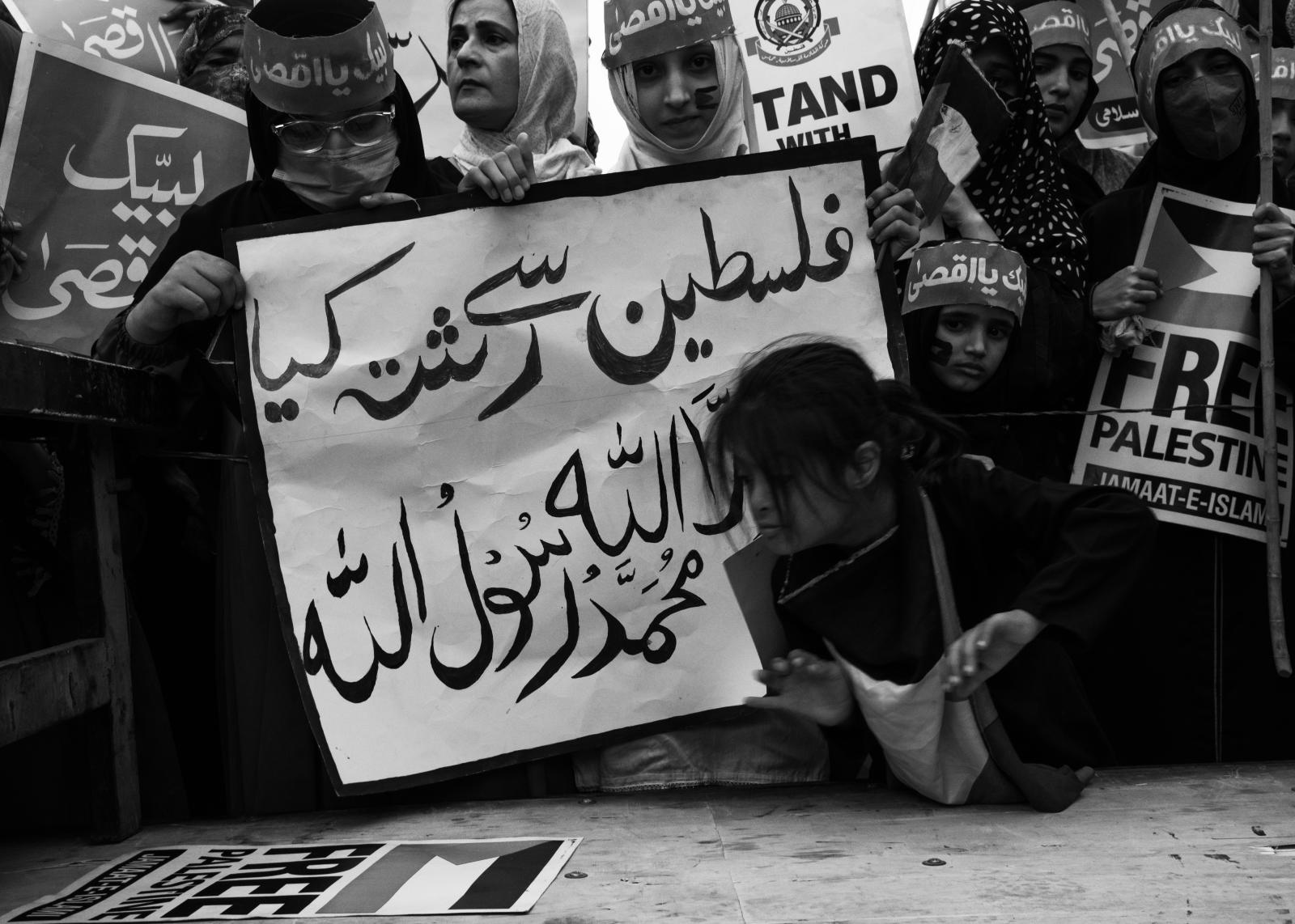 From the river to the sea - A girl takes a closer look at the placard during the protest held in solidarity with Palestine on...