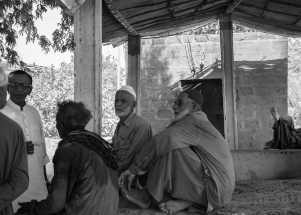 Karachi's Malir River Guardians: Defending Land, Culture, and Ecology -       A group of locals gather daily on one of the farmlands in Memon Goth, Karachi, Sindh,...