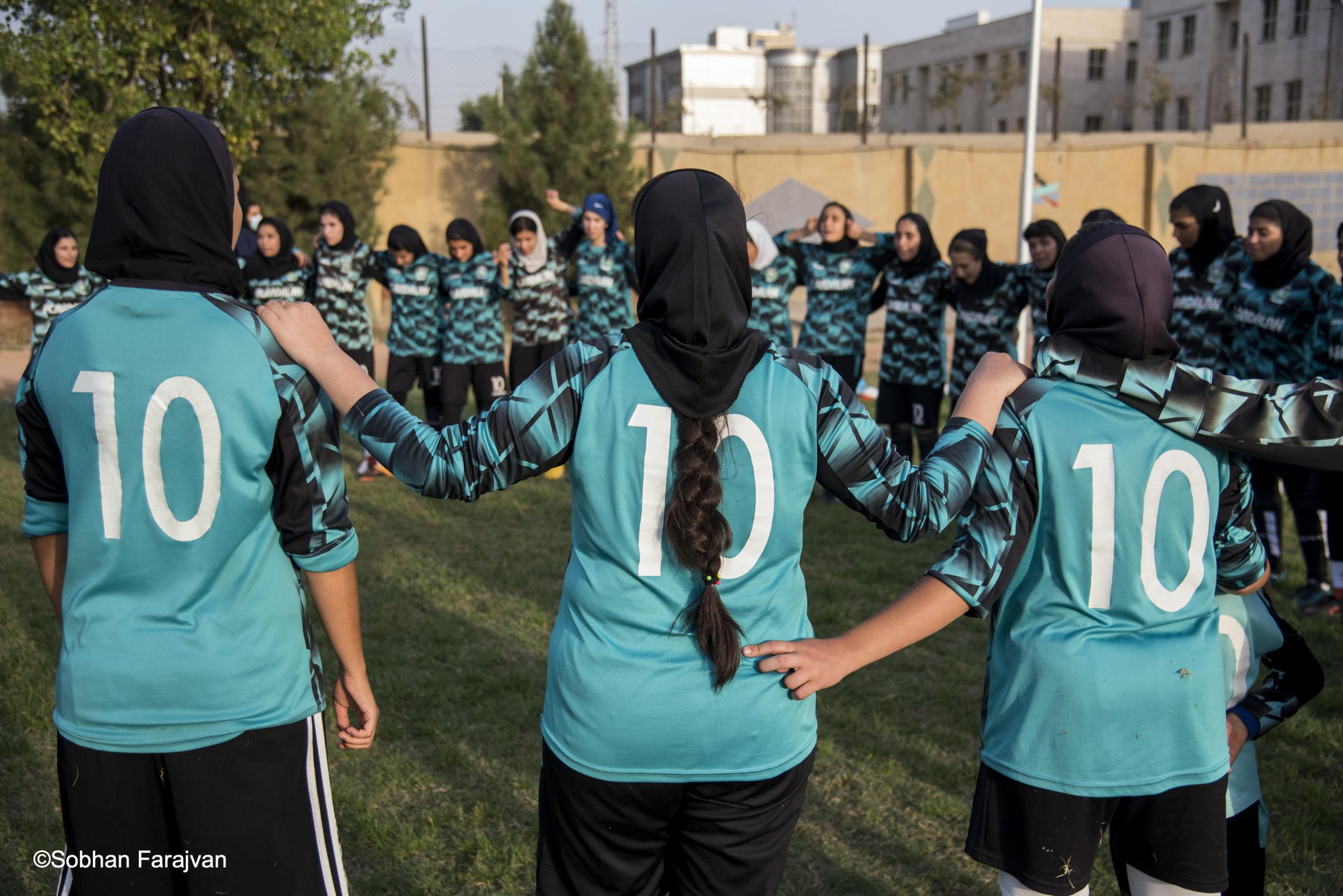 Iranian women's soccer academy - A group of Iranian girl players talks with each other...