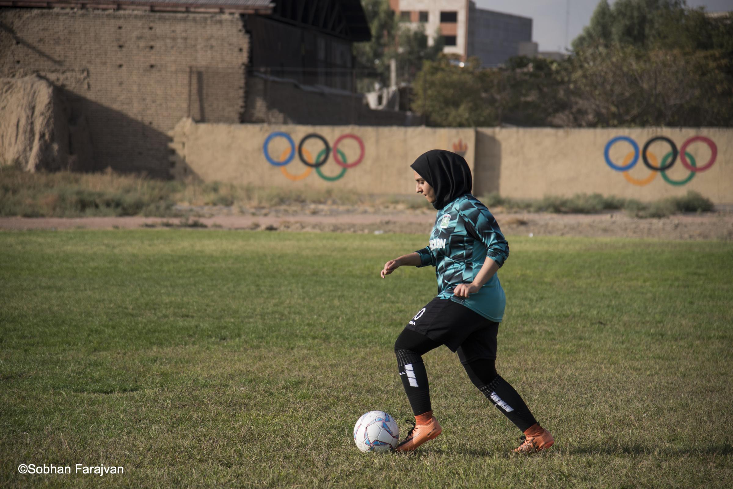 Iranian women's soccer academy - An Iranian girl player is training soccer on the academy...
