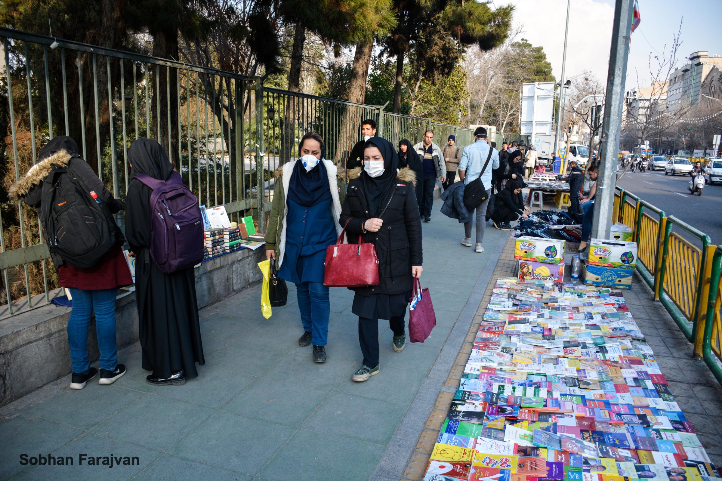 COVID-19 pandemic in Iran (2020-2022) - In the early days of COVID-19 outbreak, two women wear...
