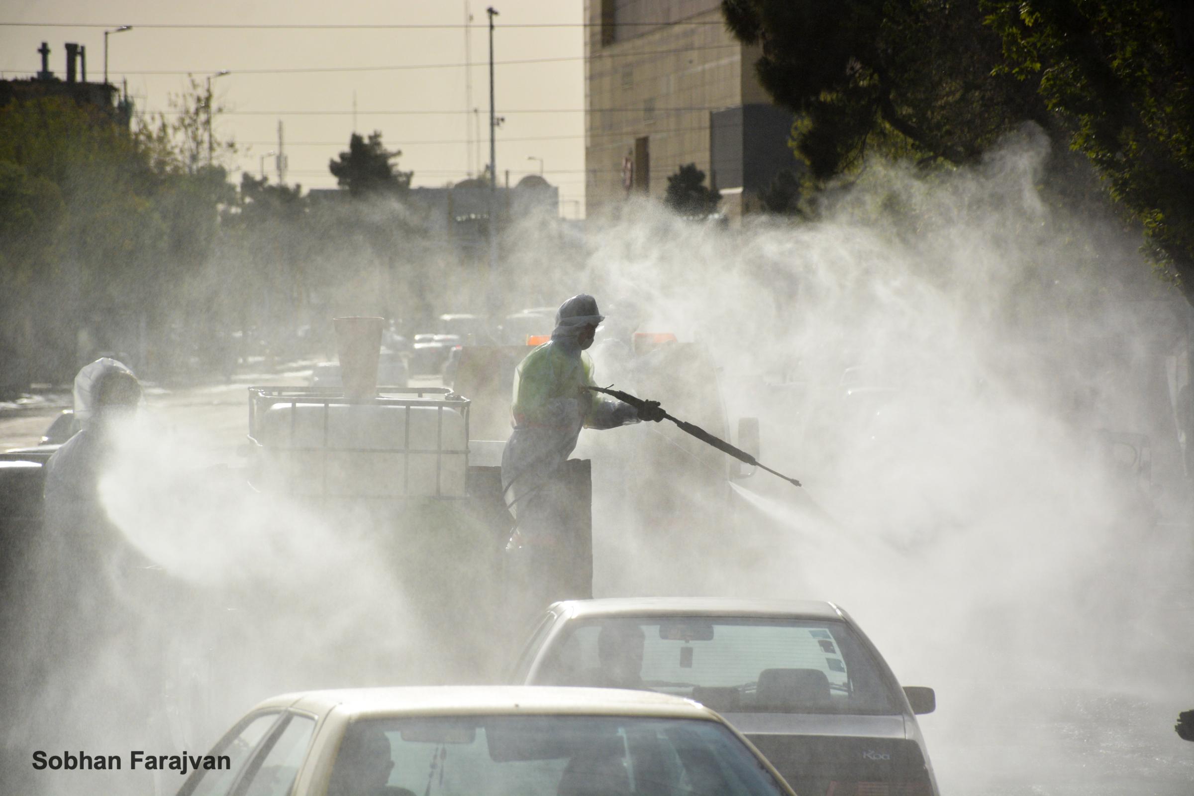 COVID-19 pandemic in Iran (2020-2022) - A Tehran municipality staff disinfects streets against...