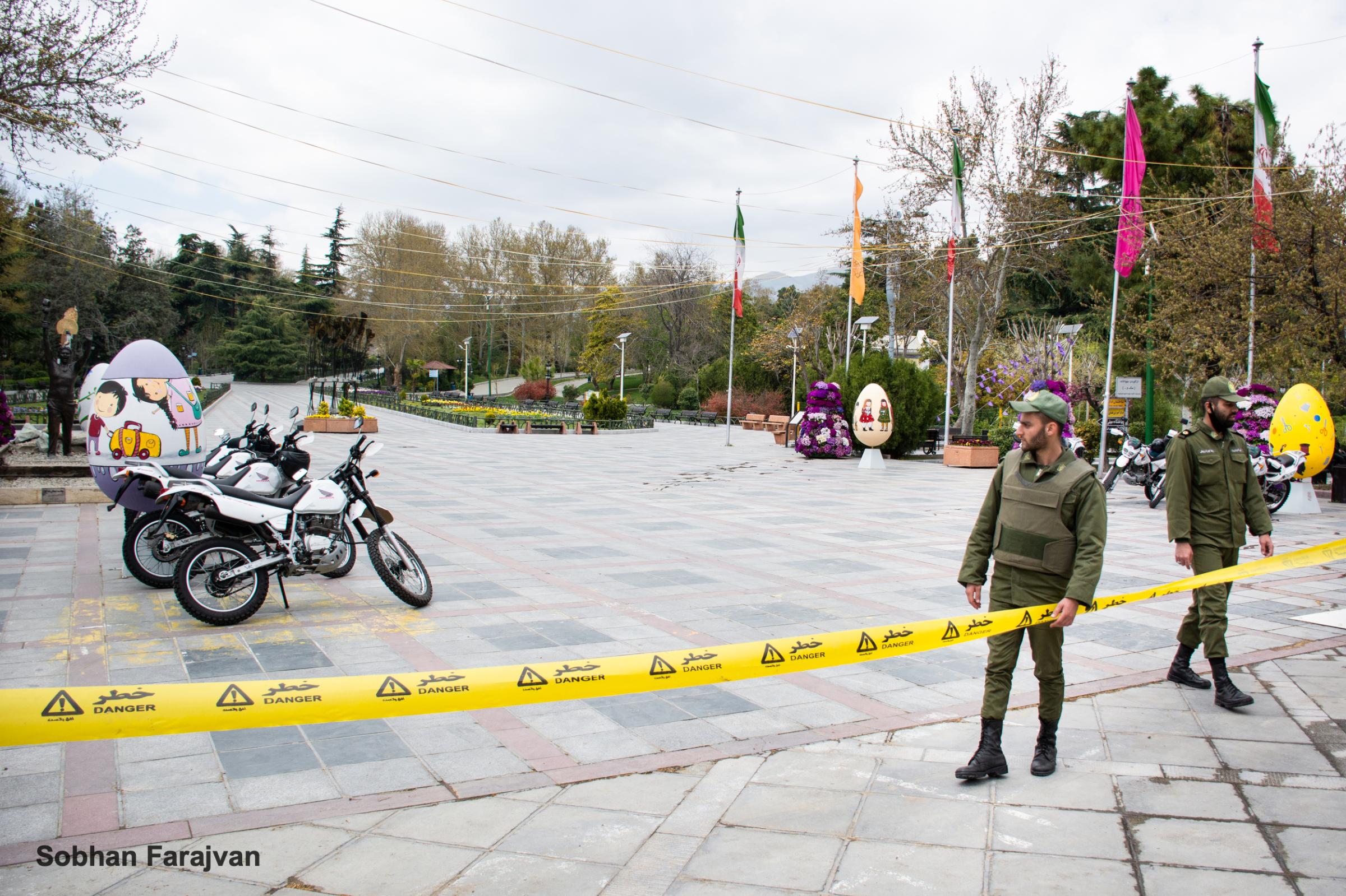 COVID-19 pandemic in Iran (2020-2022) - Two police soldiers ban people to enter a park for...