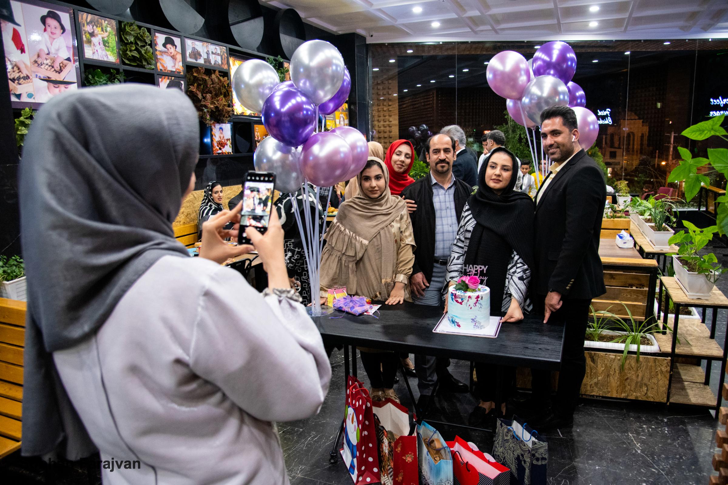 COVID-19 pandemic in Iran (2020-2022) - An Iranian family celebrates a birthday in a restaurant...