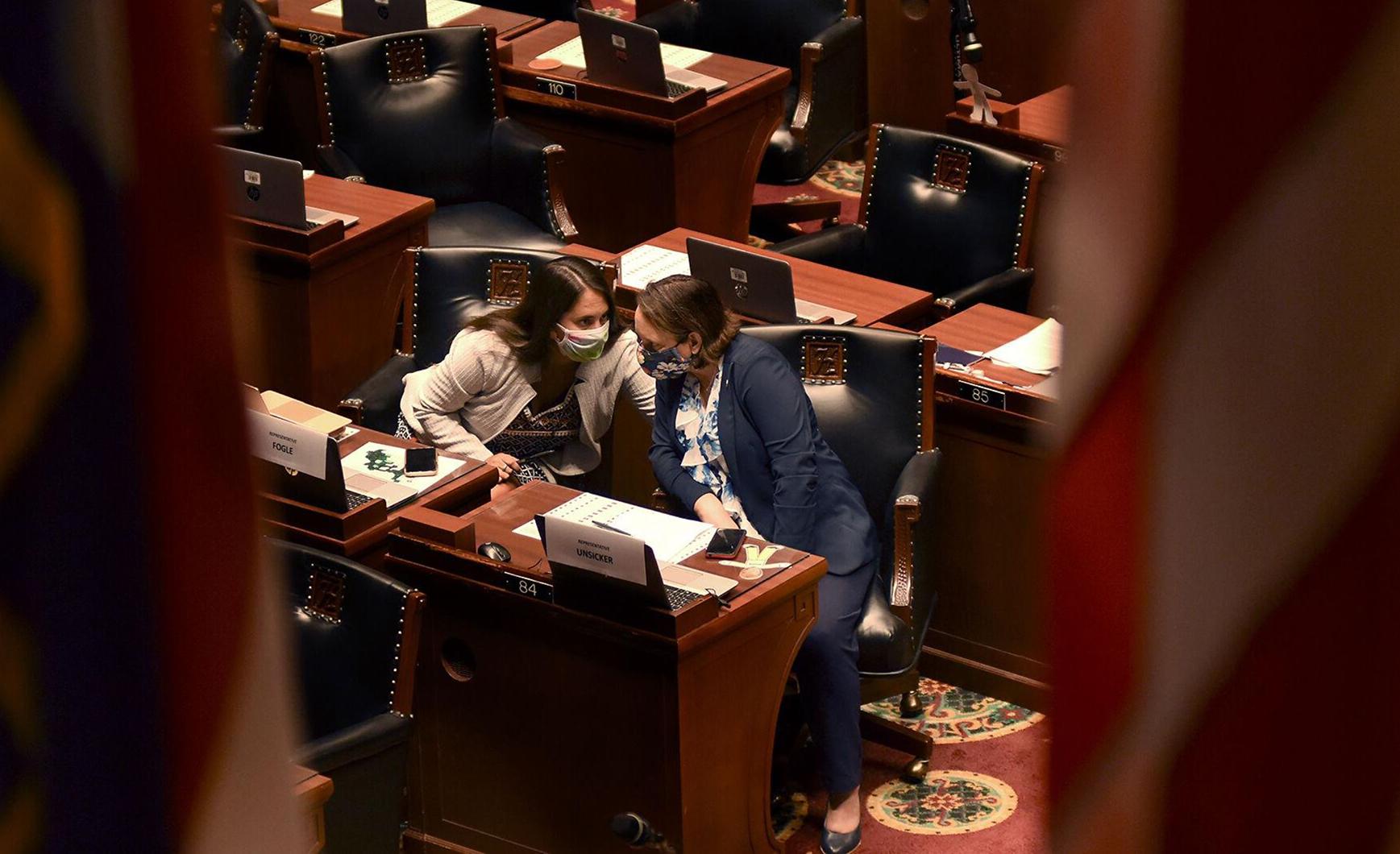 News & Feature - Rep. Betsy Fogle, left, talks to Rep. Sarah Unsicker...