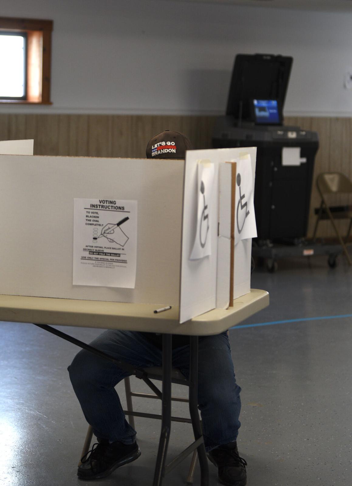 Election Day at the edge of the county - A voter fills out their ballot on Tuesday, Nov. 8, 2022,...