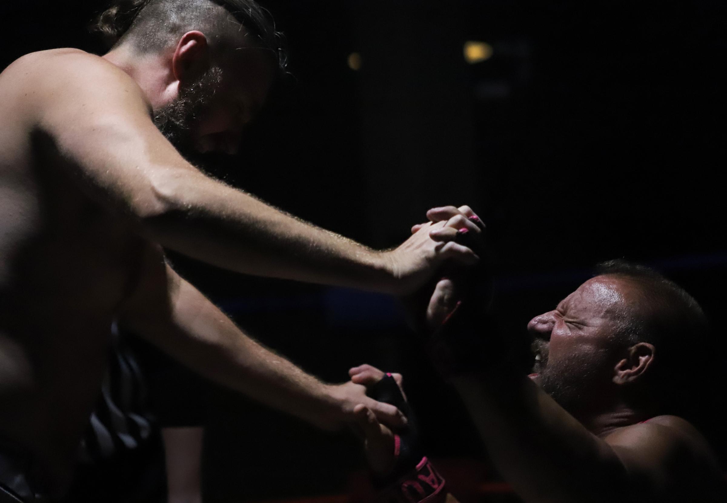 Singles -  Luchadores Bash Brawnson, left, and The Brauler wrestle...