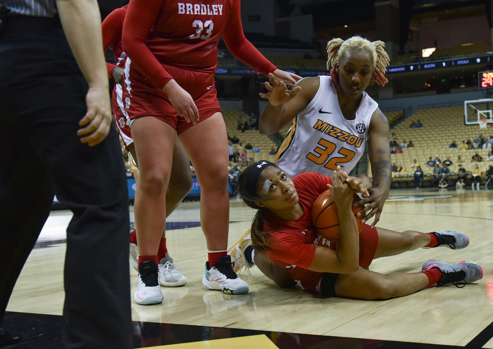 Singles -  Bradley's Jayla Kelly blocks Missouri's Alex...