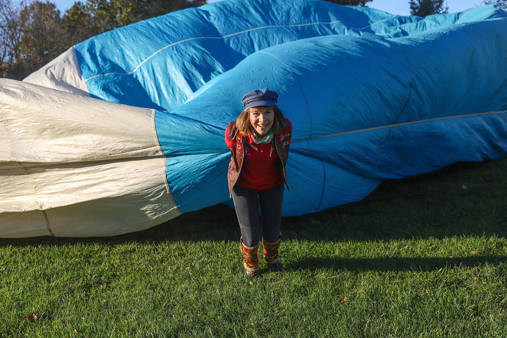 Singles -  Jan Sines pulls the side of the balloon during cold...