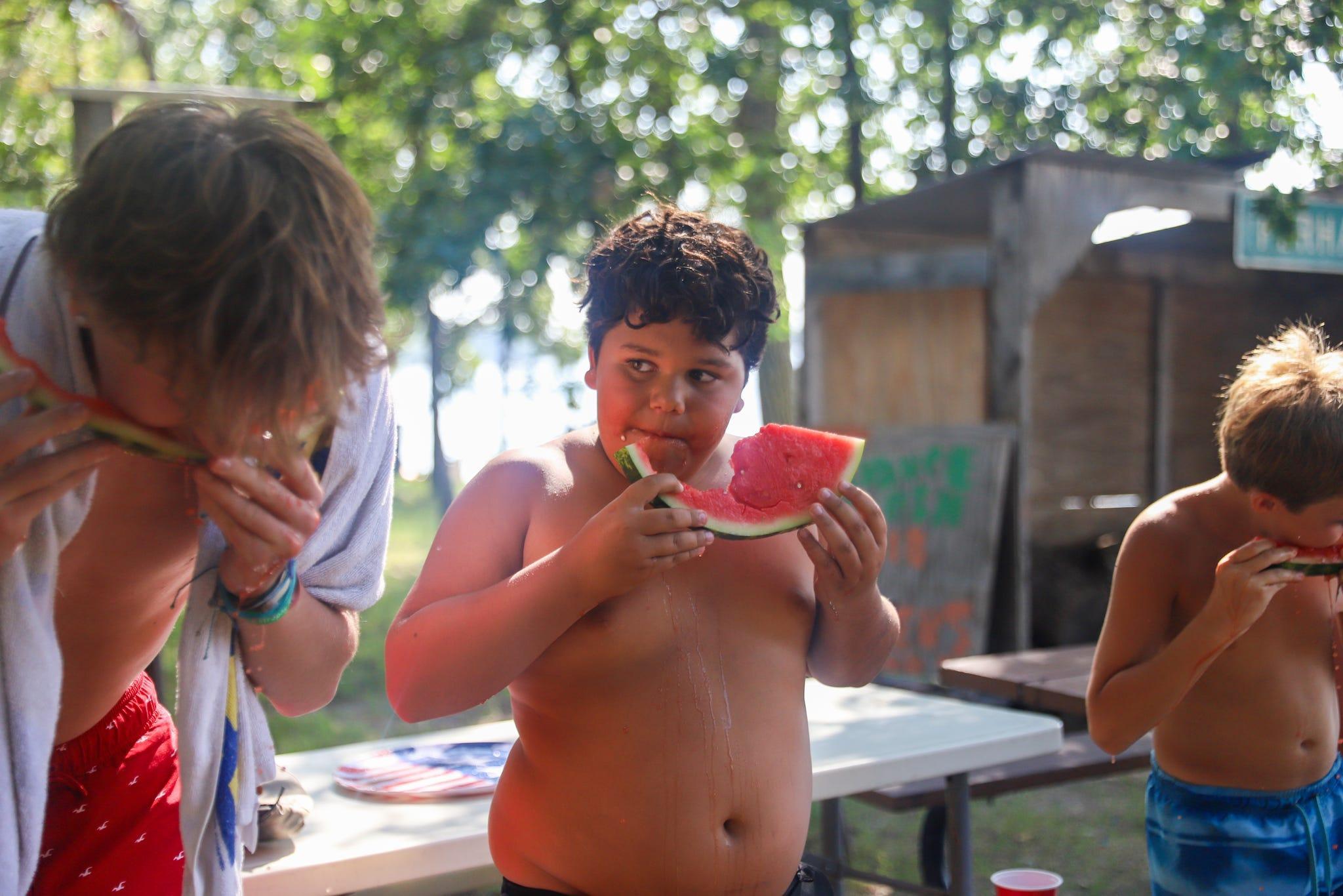 Singles -  MJ Karr looks to his opponent during a watermelon eating...