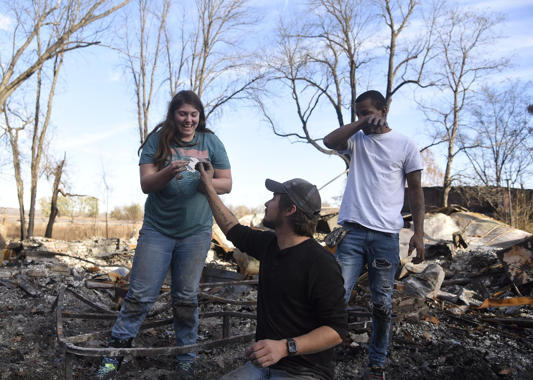  Matthew Culbert passes Heaven Maggard their friend Kelsey Knox&#39;s wedding ring after searching through the ashes with Drew Alexander,...
