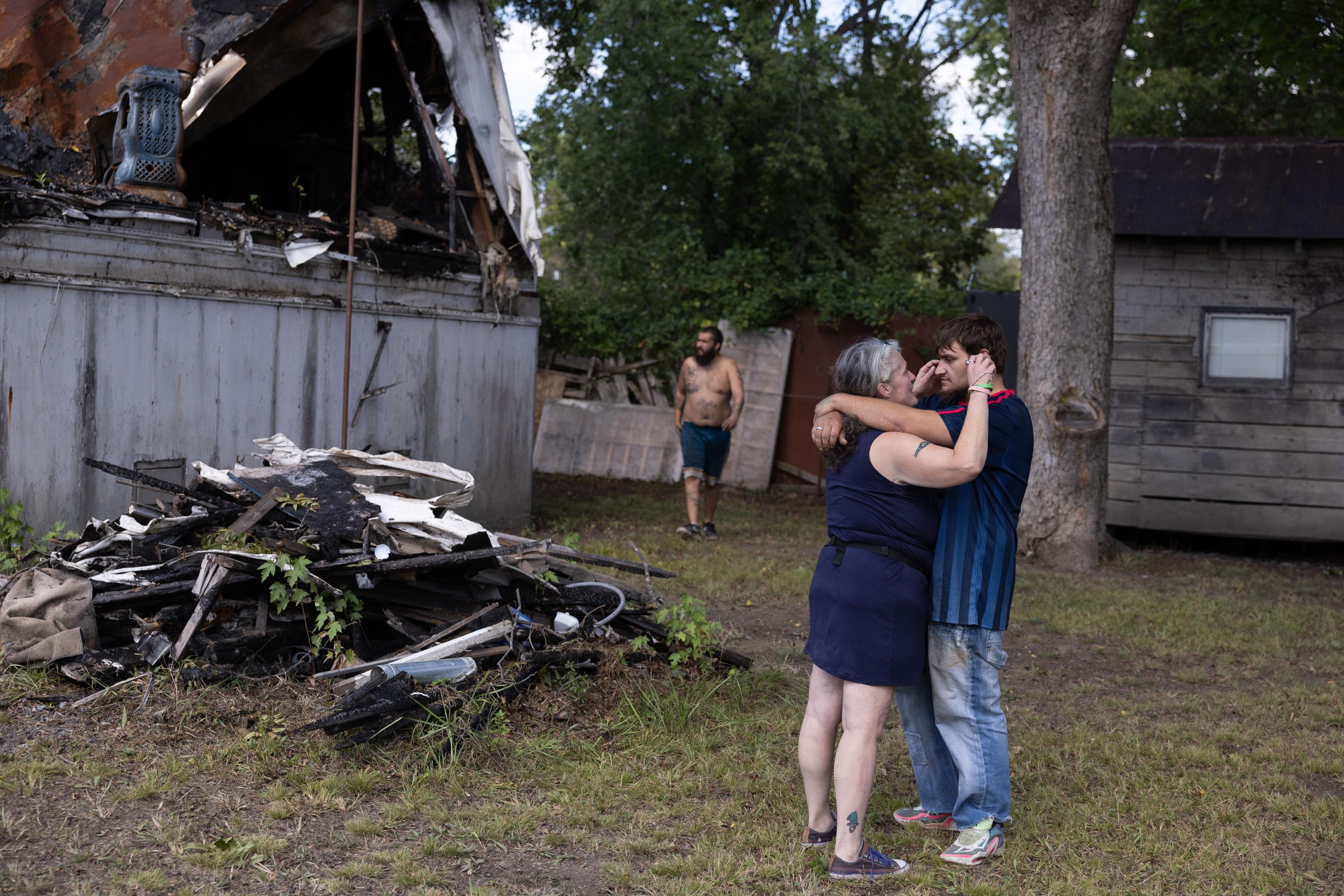 Carrie, Keeper of the House - Carrie Kuhl and Austin Bledsoe hold each other after an...