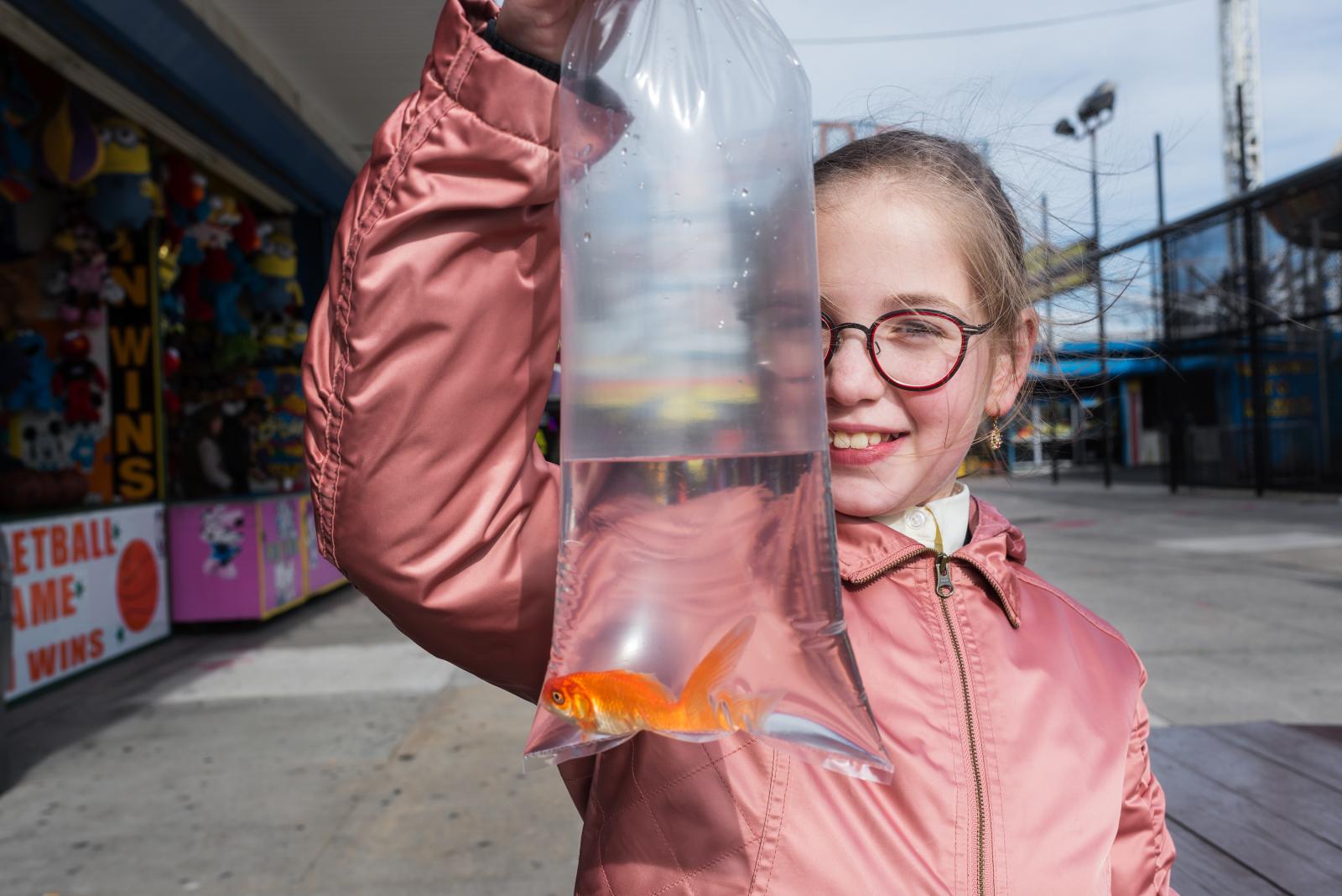 A girl and her goldfish. 