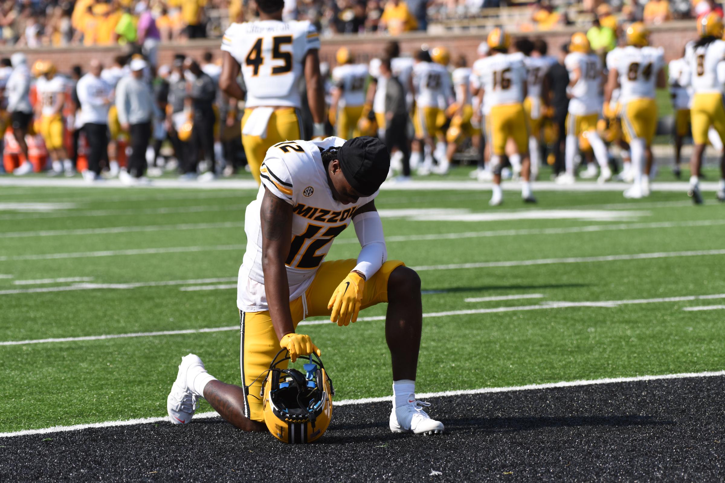 DJ Jackson kneels in the endzone before the game on Saturday, Sept. 17, 2022 at Memorial Stadium in Columbia.