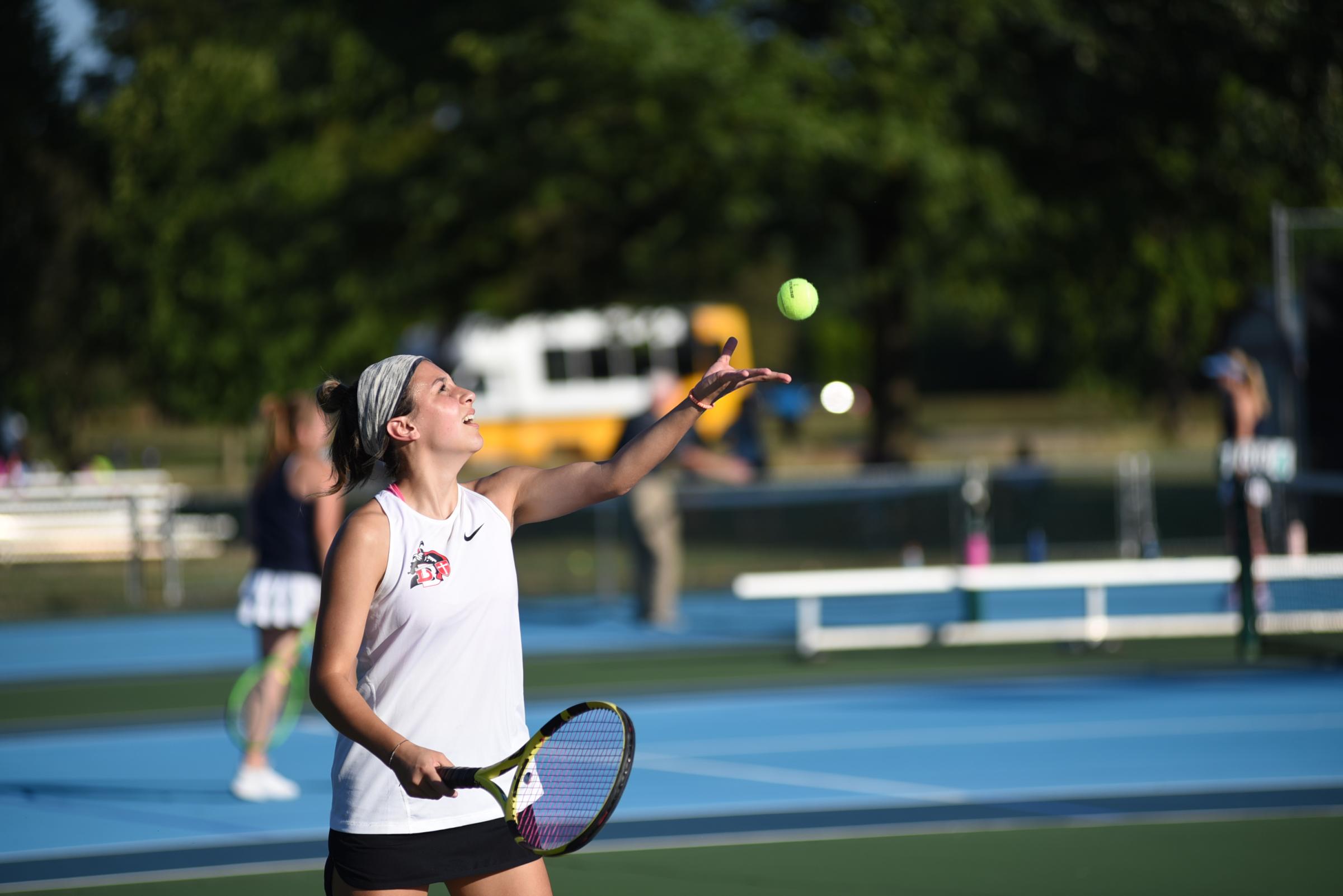 Photojournalism - DuBourg’s Kate Bettlach serves the ball at their...