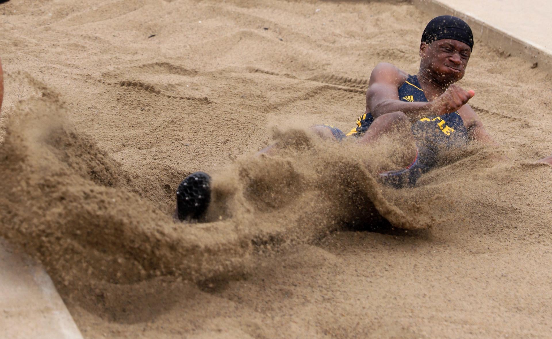 Singles - Battle junior Jamal Jones lands in the sand in the...