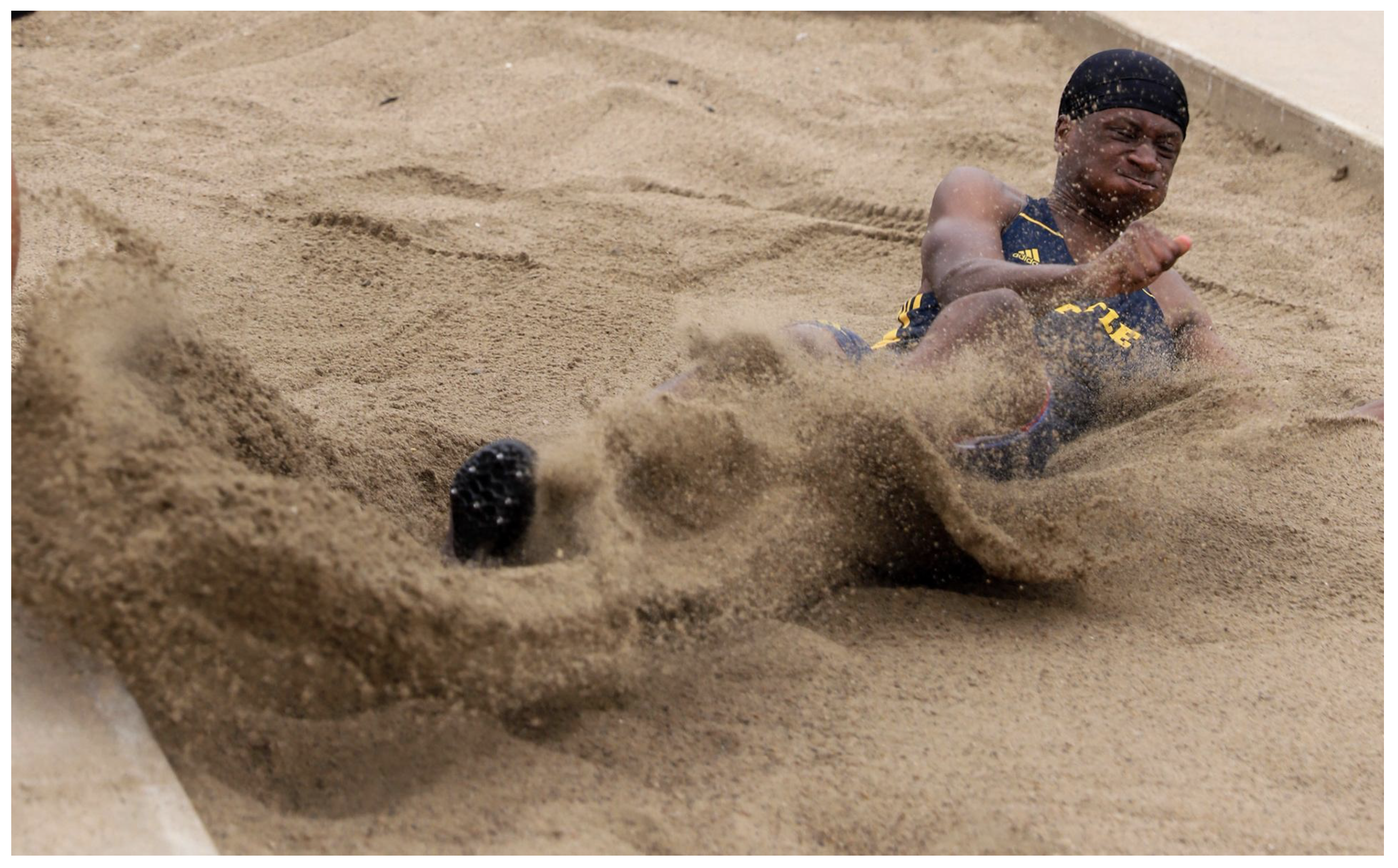 Sports - Battle junior Jamal Jones lands in the sand in the...