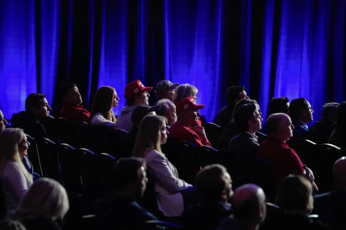 2024 Iowa Caucus  - Fans watch the Fox News town hall with former President Donald Trump at the Iowa Events Center on...