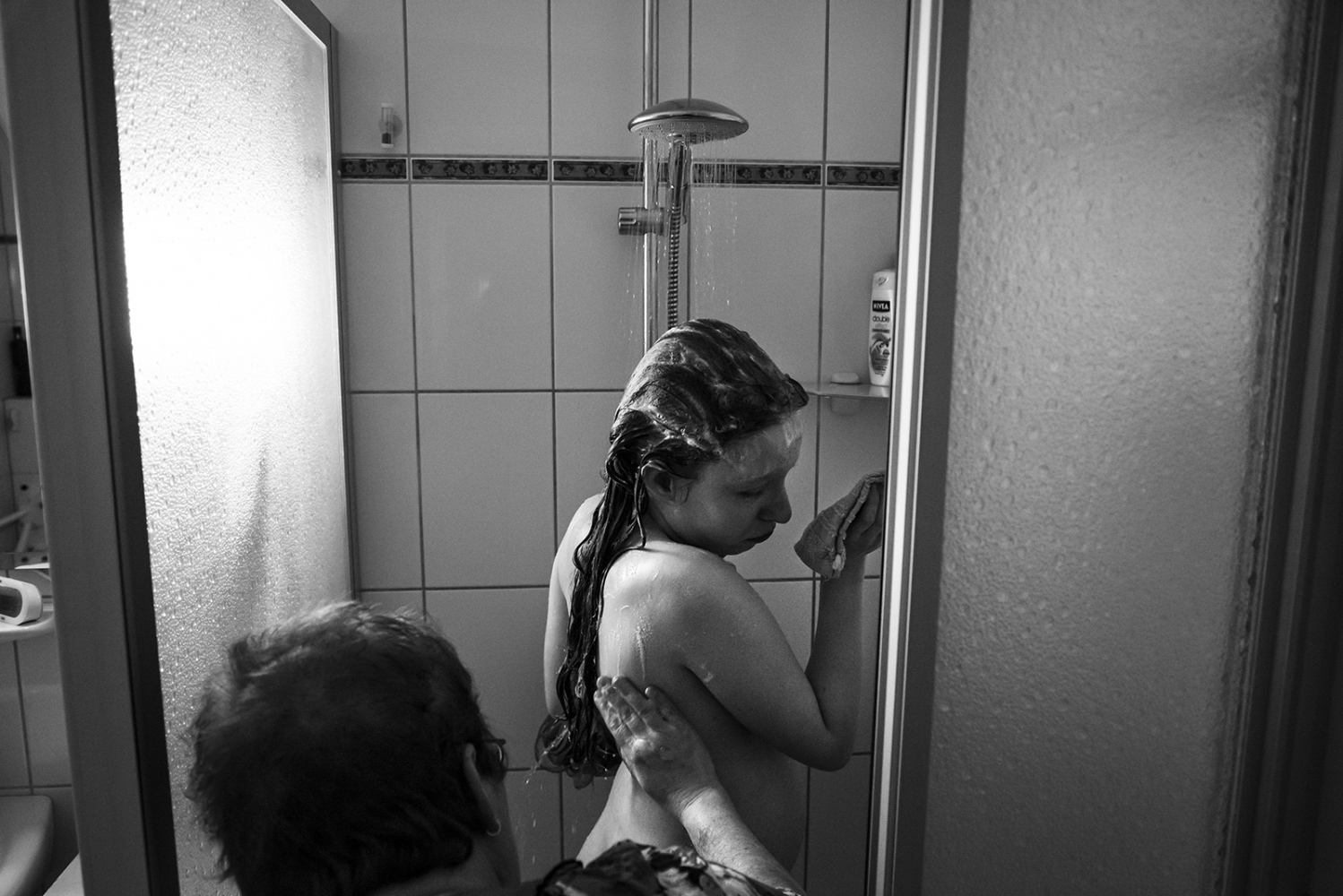 Suzanne, Living with PWS - Gonny helps Suzanne taking a shower.
