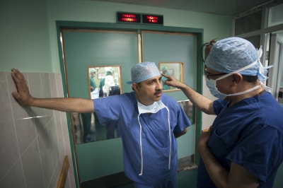   Dr Sanjay Mehra (dual British/Indian nationality) from the Royal Liverpool University Hospital in discussion with fellow surgeon from Liverpool Dr Abdul Hammad prior to starting surgery on a transplant patient.  