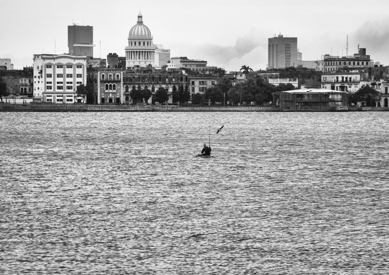 Fishing in the Havana's bay a few hours before the Rafael hurricane's impact  | Buy this image