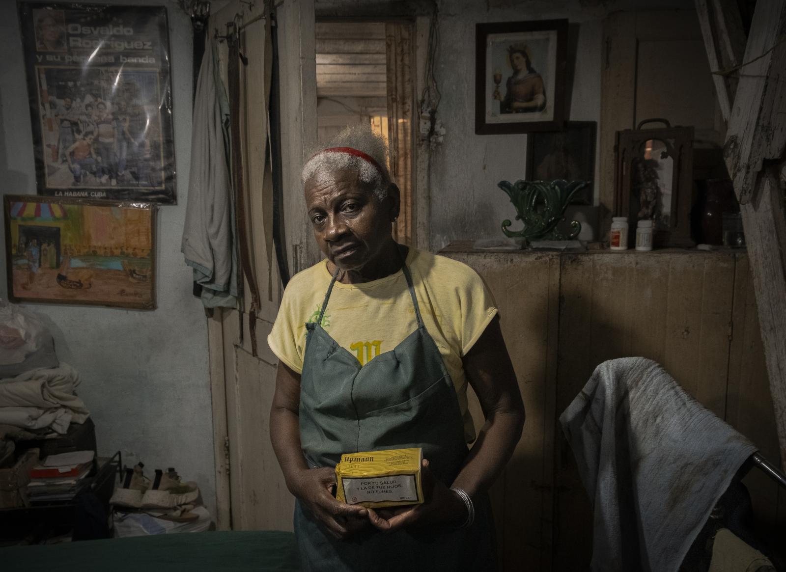 Portrait of my mom with a box of cigarettes  | Buy this image