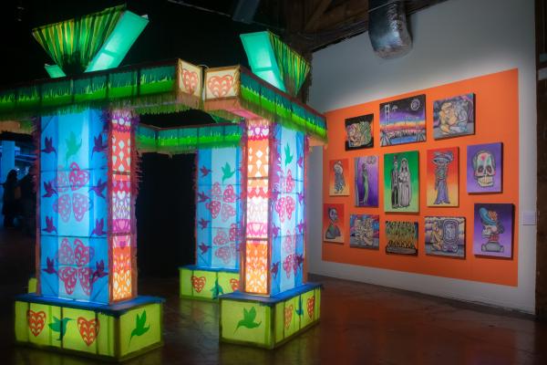 Image from SomArts - An art installation with papel picado is shown at SOMArts...