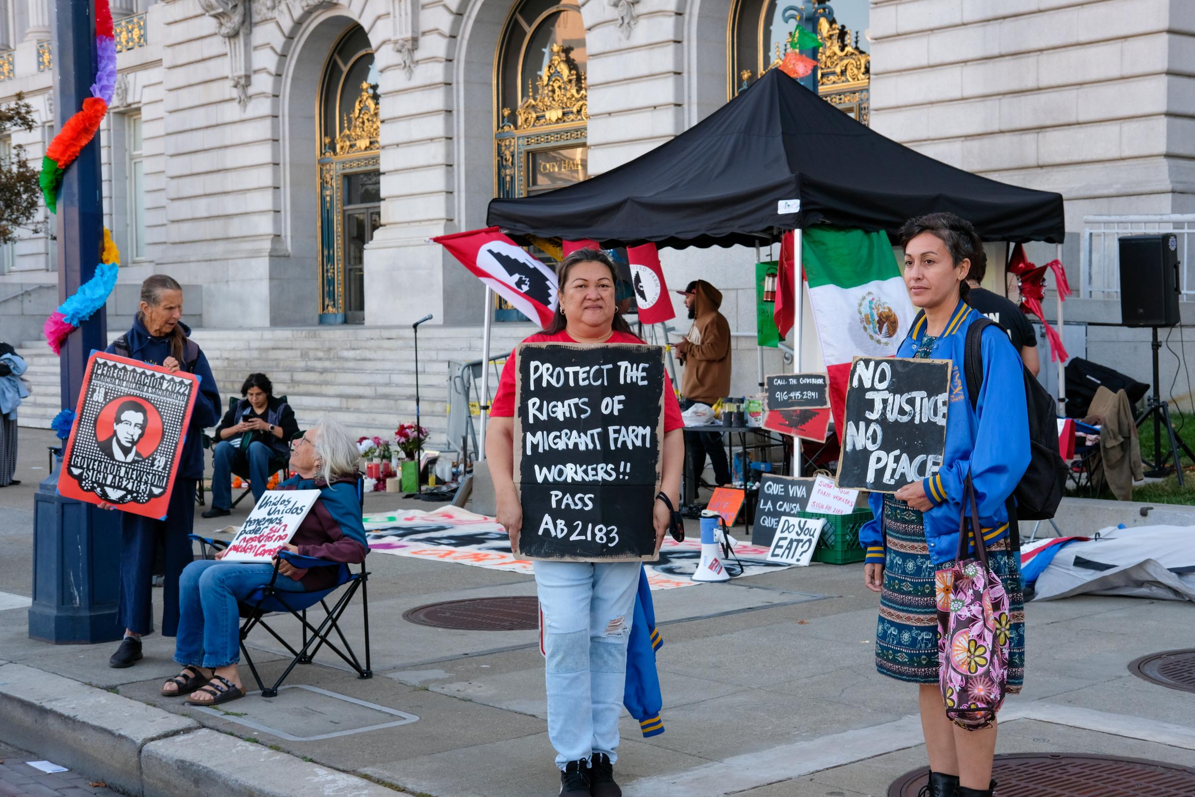 Farmworkers Solidarity Vigil - Josephine Rivera, left, and Alexis Luna, right, from the...