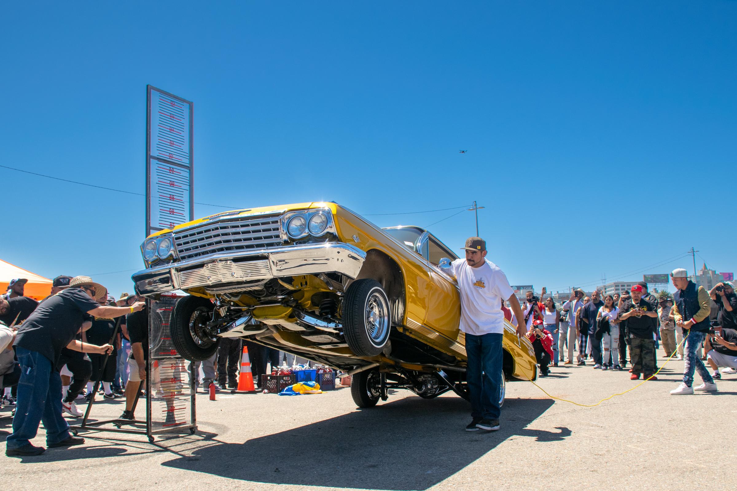 Lowriders Show: King of the Streets - A 1962 gold Impala owned by Alexander Dominguez...