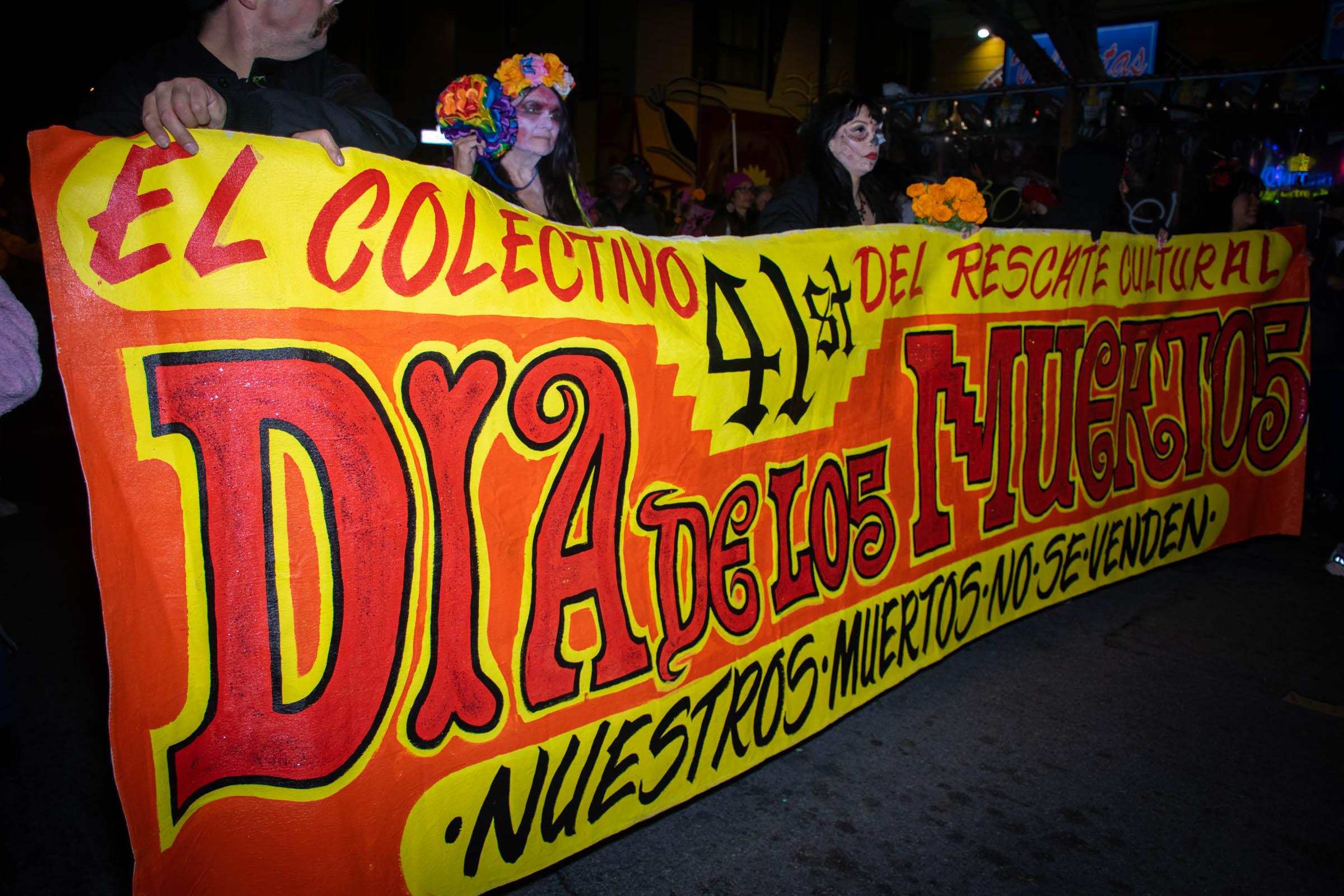 Day of the Dead Celebration - Organizers hold a banner during the Dia de los Muertos...