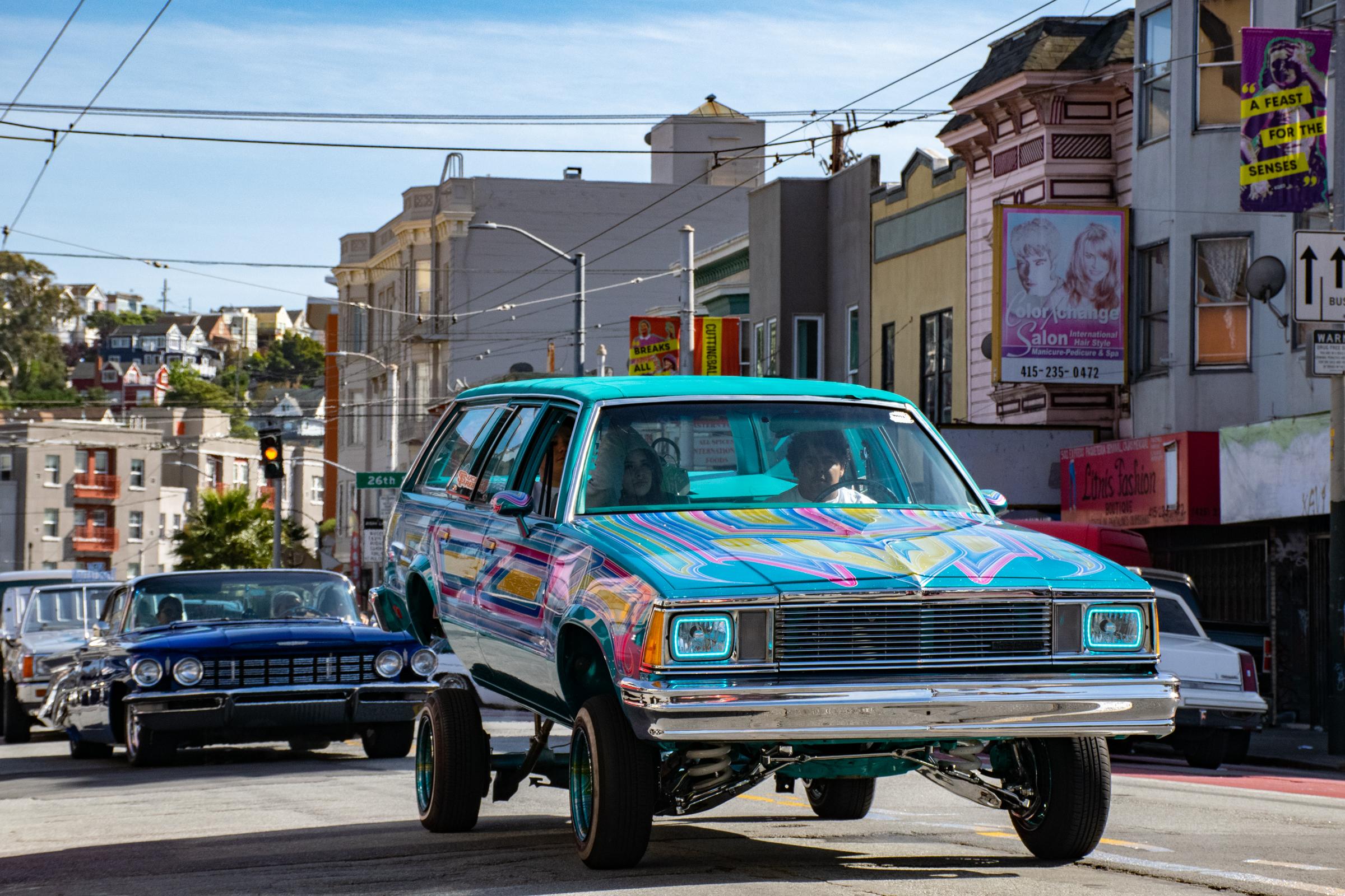 Lowriders Cinco de Mayo Show -  A colorful lowrider bounces while cruising down Mission...