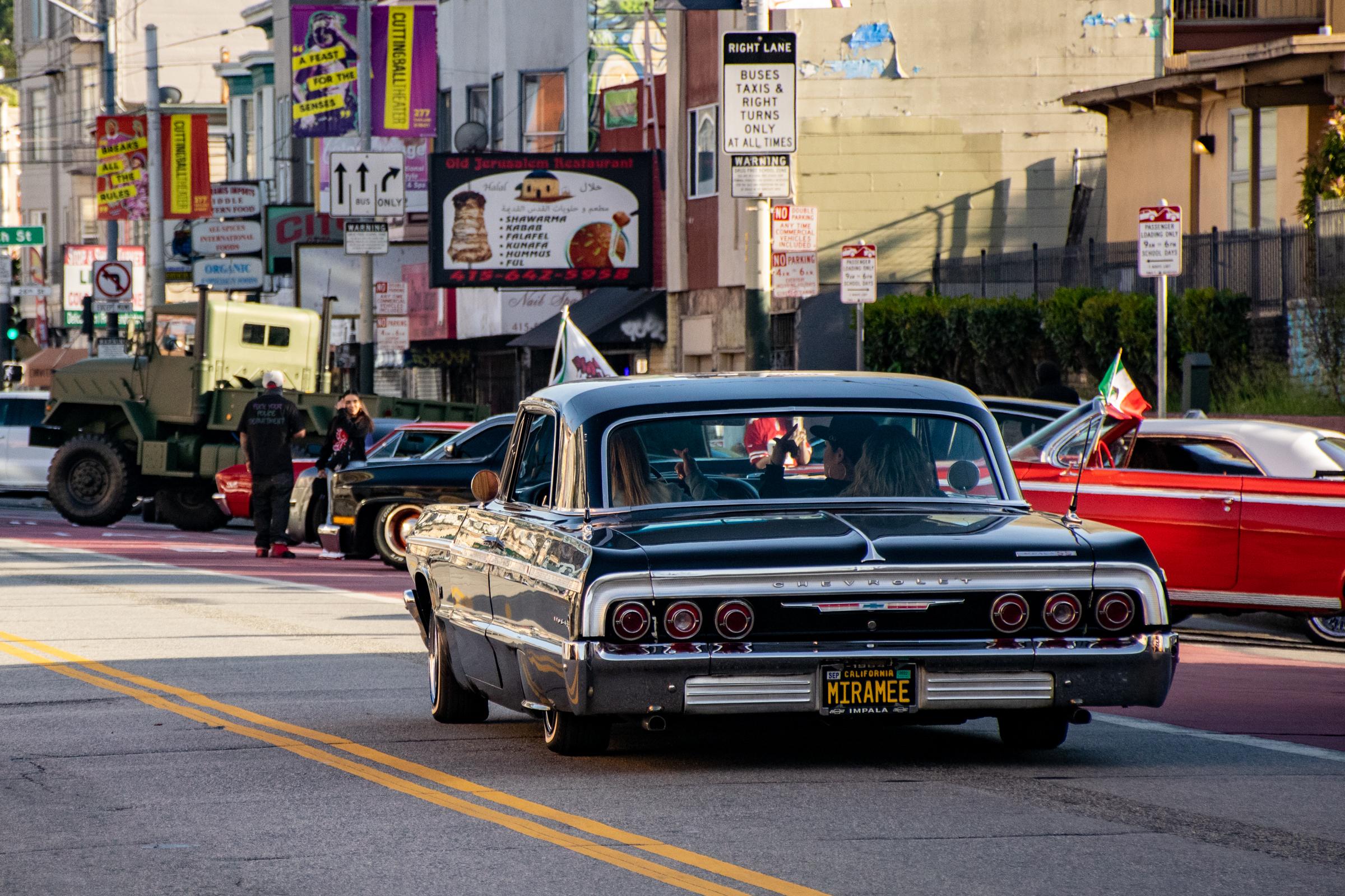 Lowriders Cinco de Mayo Show -  A black lowrider strolls down Mission street during the...