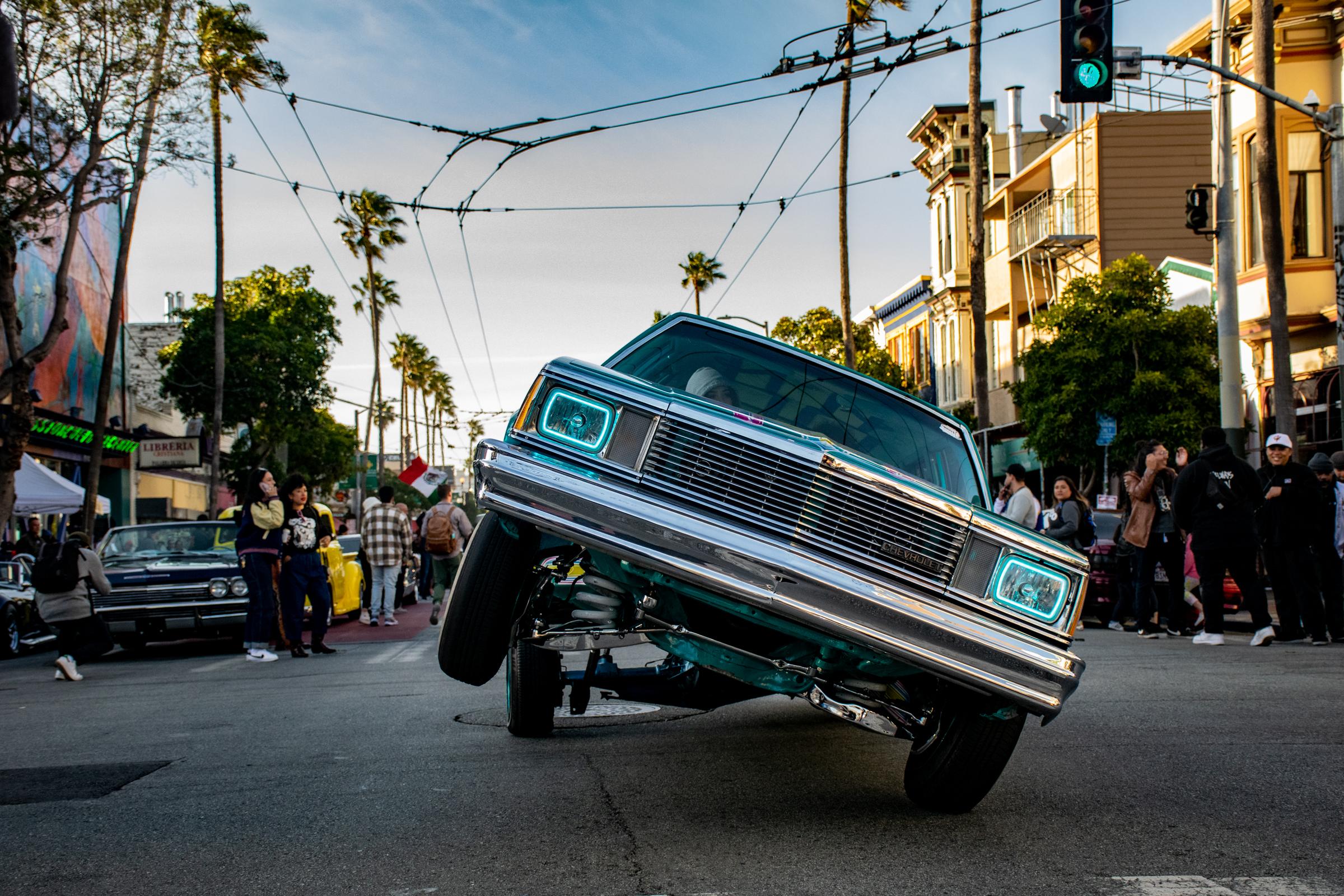 Lowriders Cinco de Mayo Show -  A lowrider bounces and cruises down Mission street while...