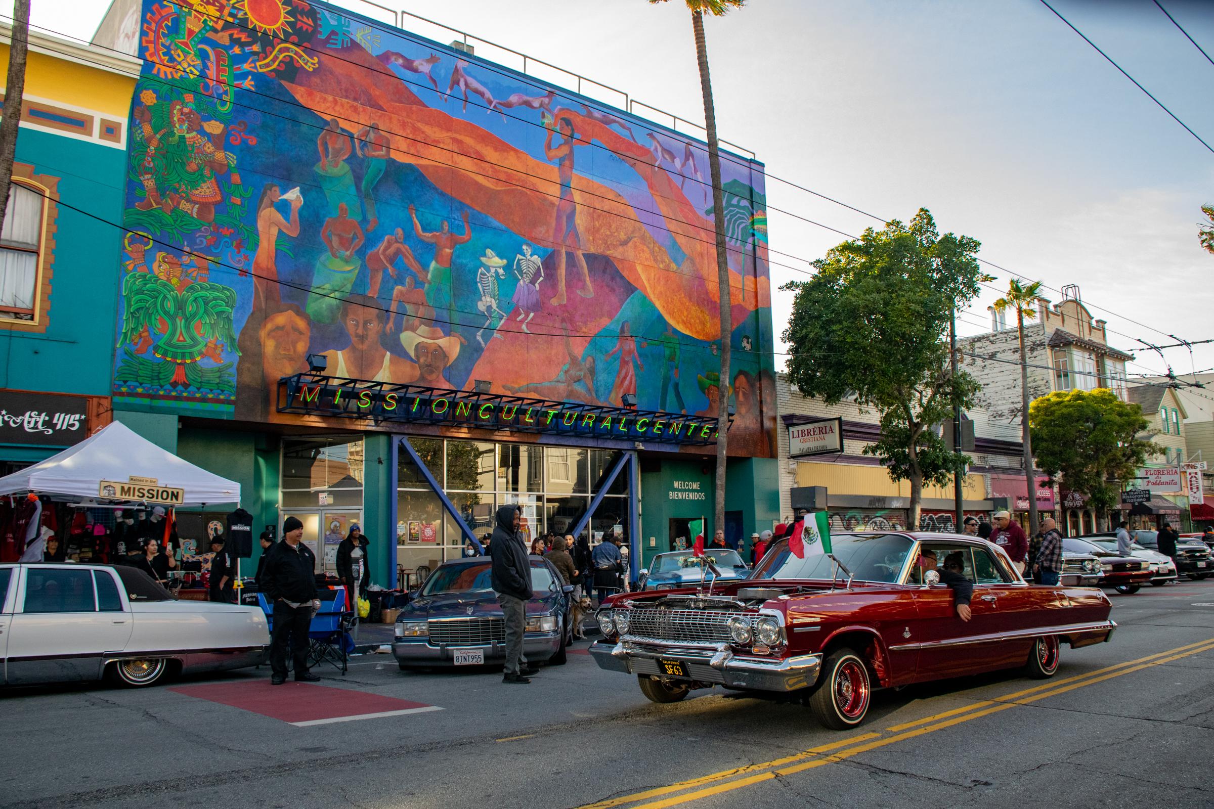 Lowriders Cinco de Mayo Show -  A red lowrider with Mexican flags on the front of the...