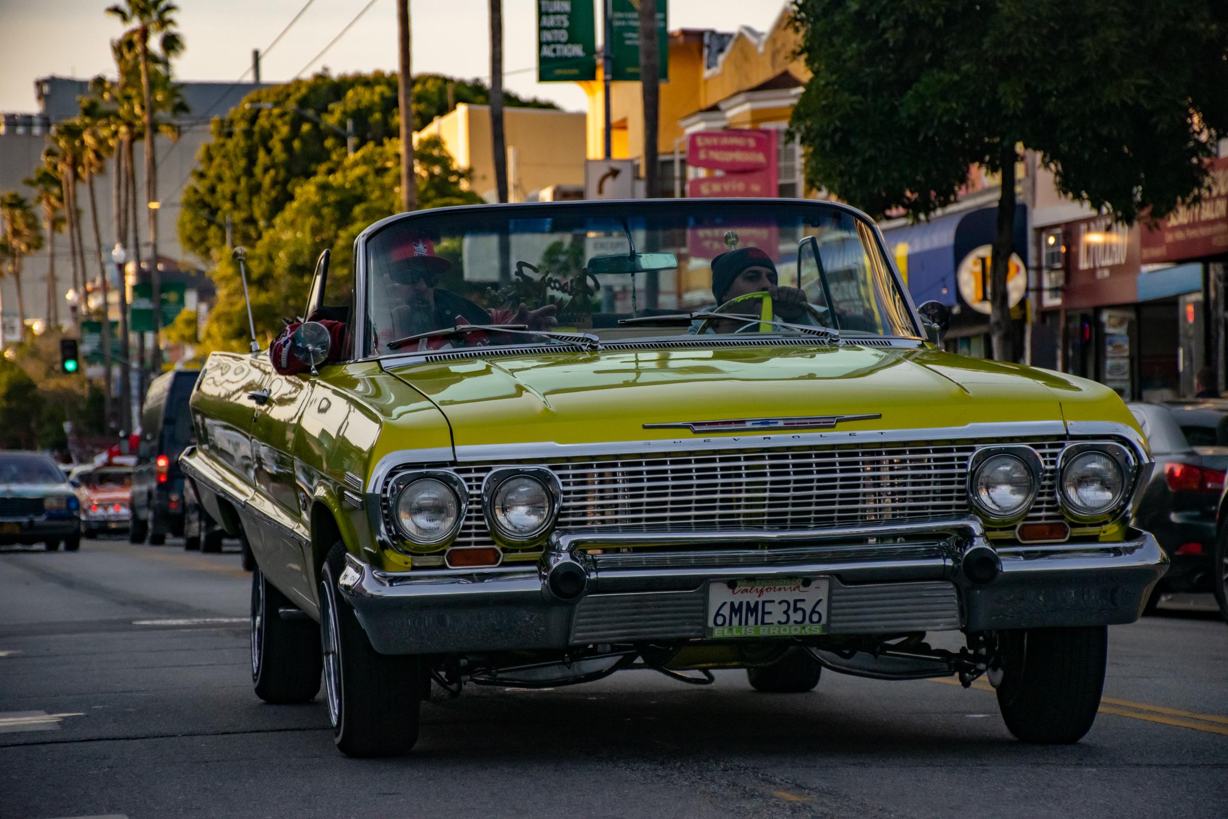 Lowriders Cinco de Mayo Show -  A yellow lowrider bounces and cruises down Mission...