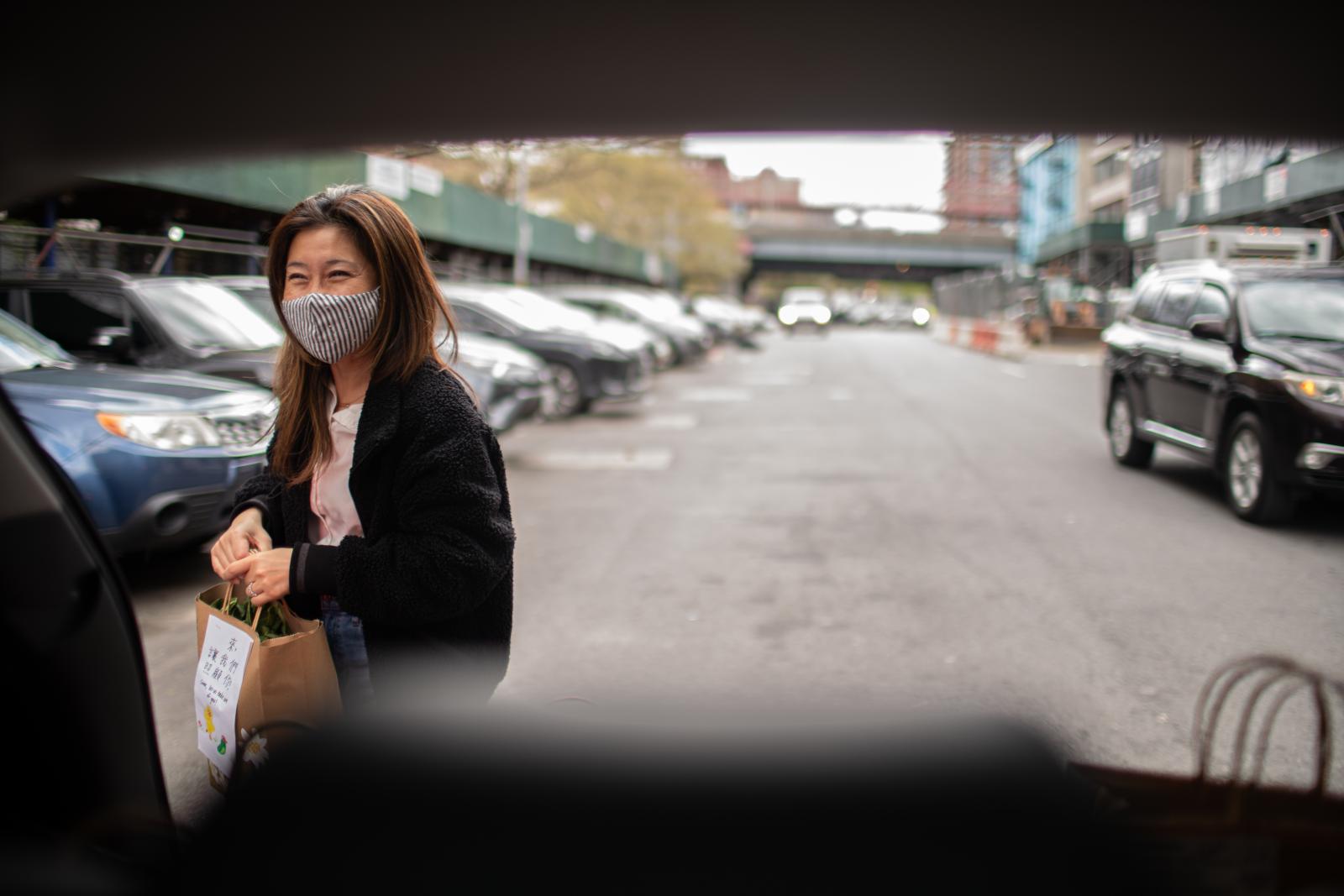 Image from People - Susan Lee delivers food to seniors' homes in the...