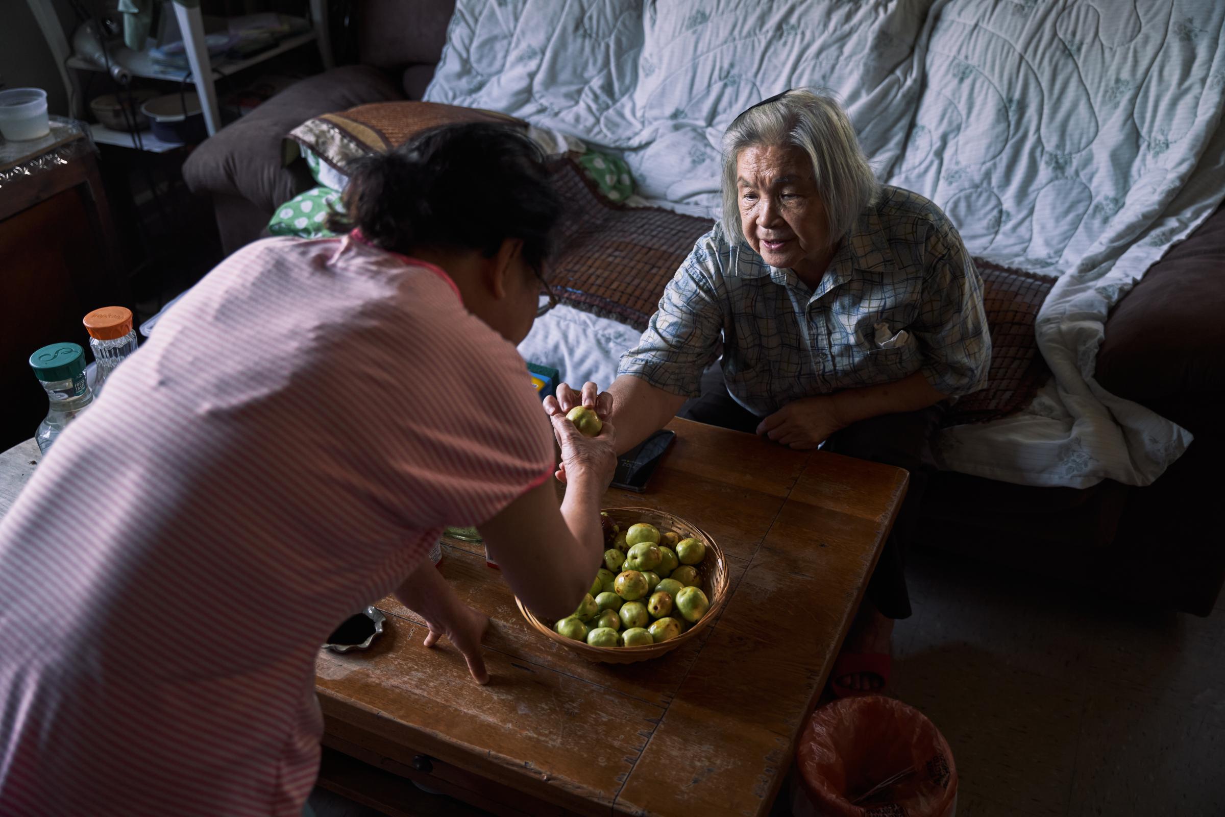 East Harlem - Alice Lin, Huang’s neighbor from upstairs, shared...