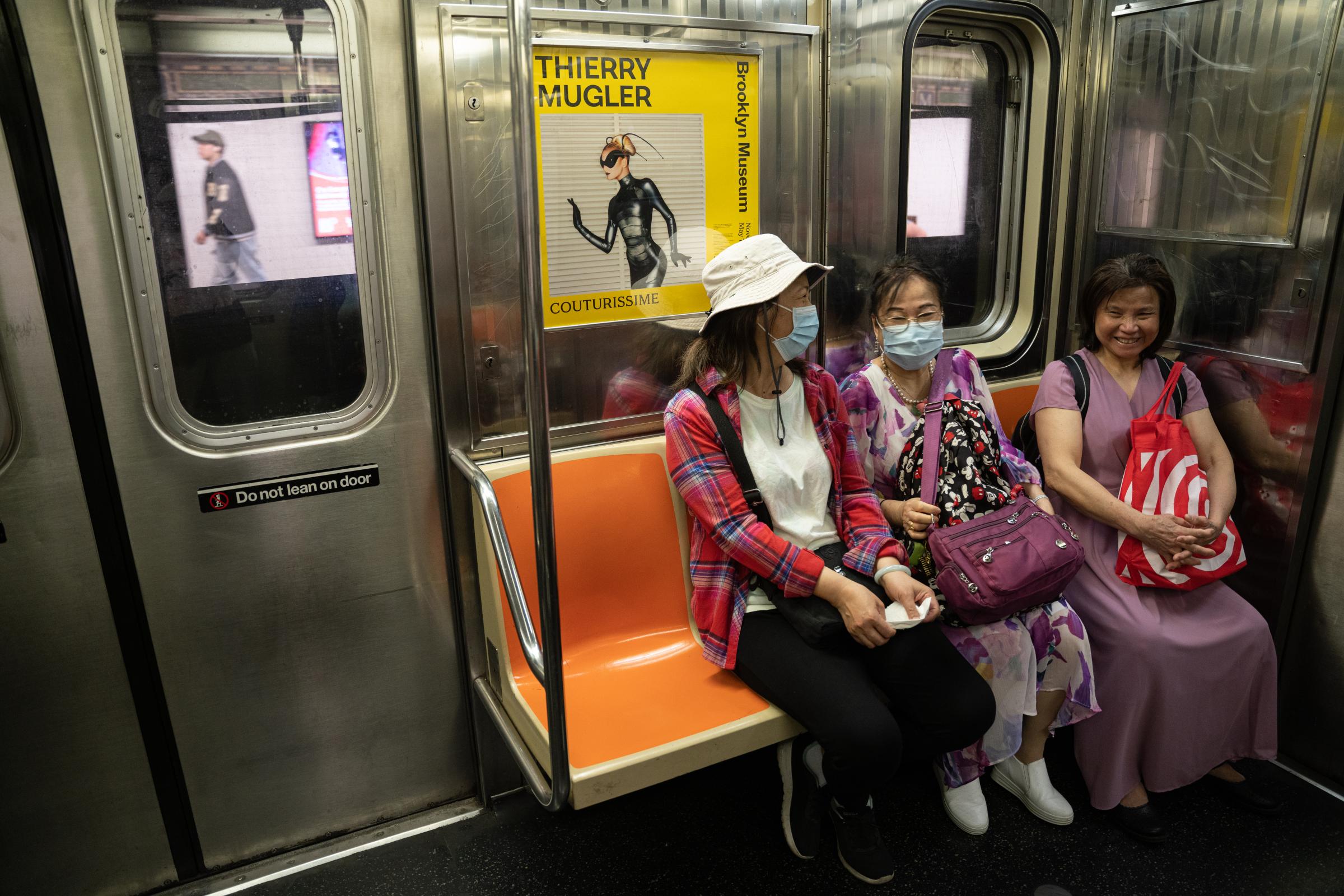 East Harlem - Neighbors of East Harlem sat in the subway.