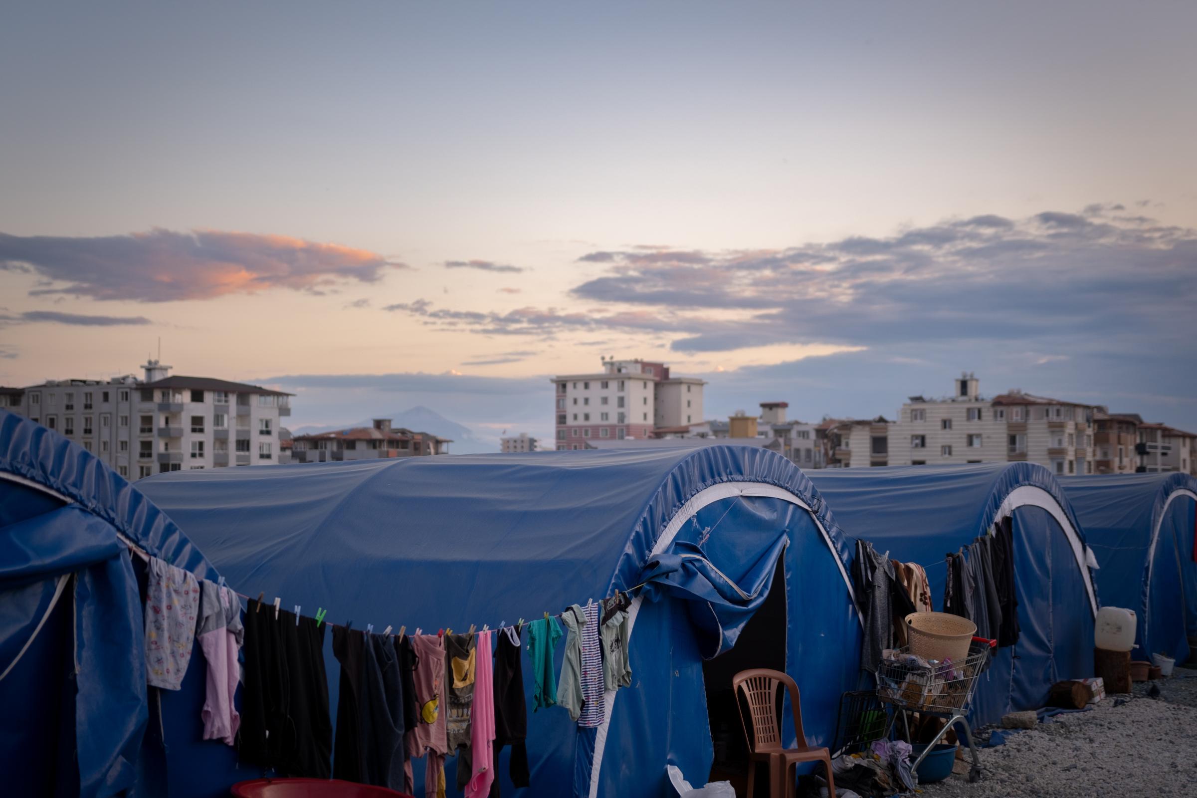 One year on, the ancient city of Antakya struggles to show its first signs of life -  Many people were placed in temporary tent camps after the earthquake. 