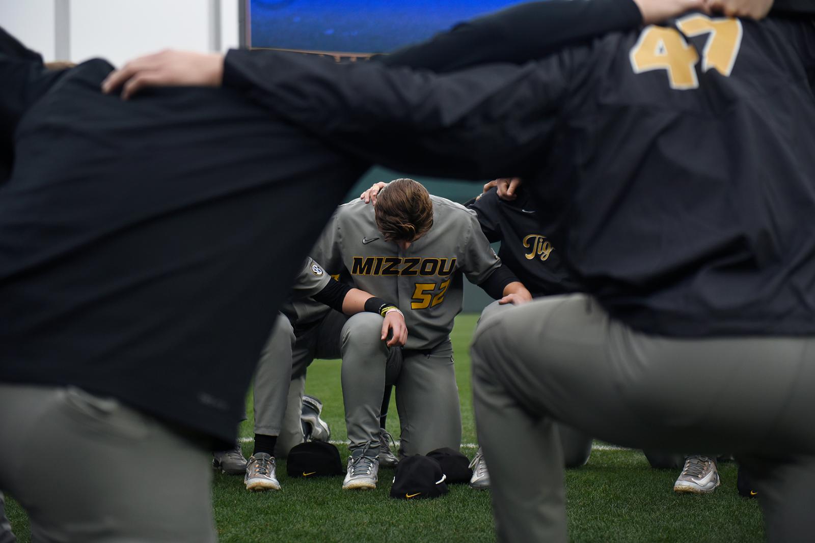 Image from Sports - Cam Careswell prays with his teammates before the game on...