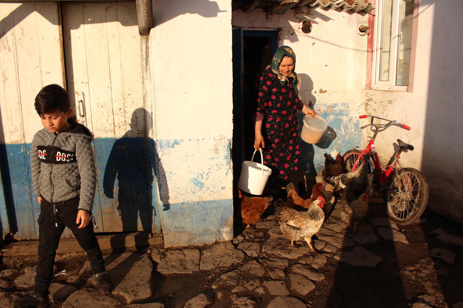  Yetar and Murad, one of her th...children get ready for school. 