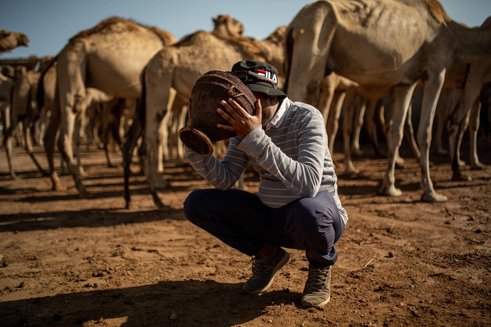 Mohamed sips fresh milk from a ... or his workers in rural areas.