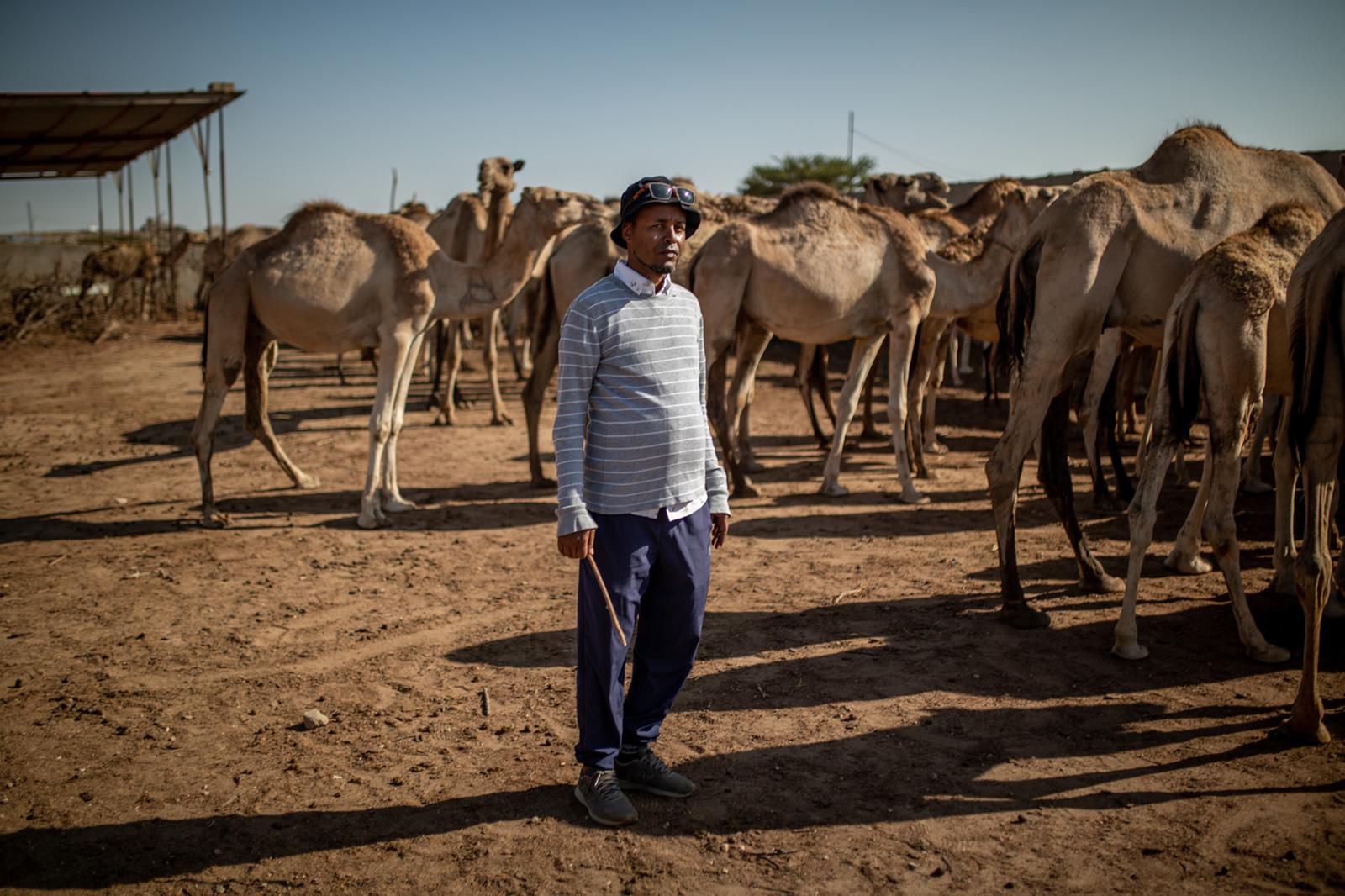 Portrait of Mohamed at his came... or his workers in rural areas.